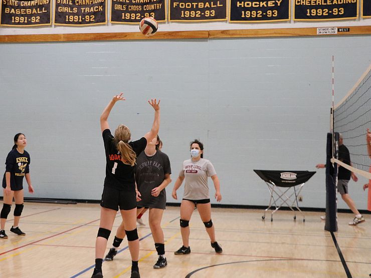 young people playing volleyball