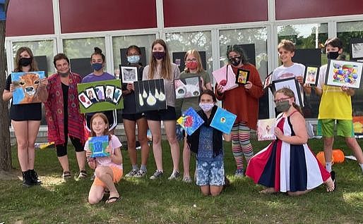 Children holding their finished art work