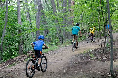 young riders enjoying the dirt trails at bike park