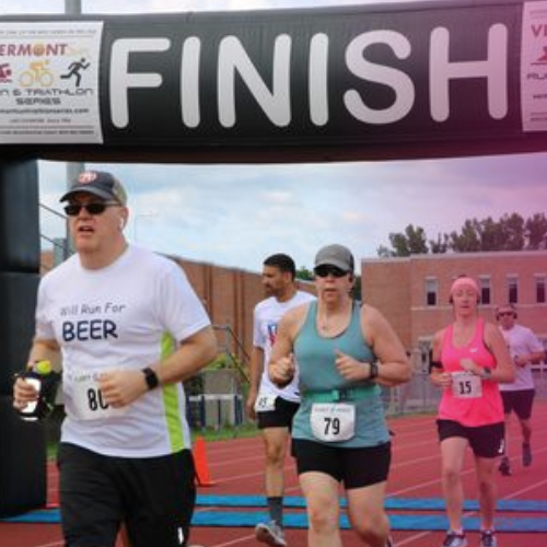 runners crossing the finish line at a race