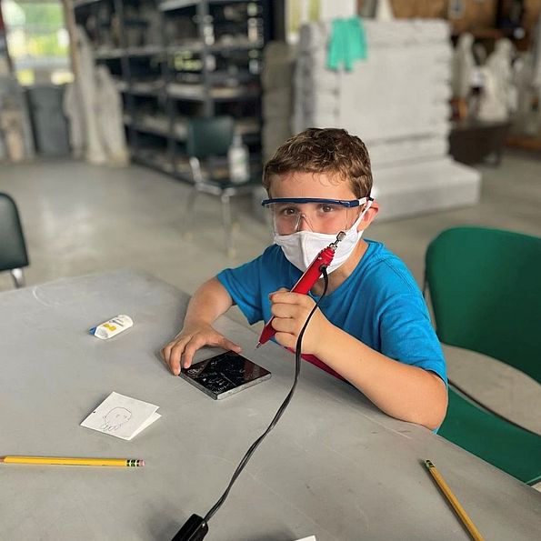 boy learning at camp