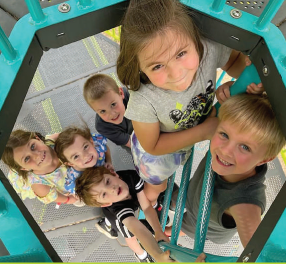 children climbing on playground equipment